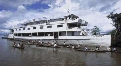 M/V Rio Amazonas surrounded by local villagers